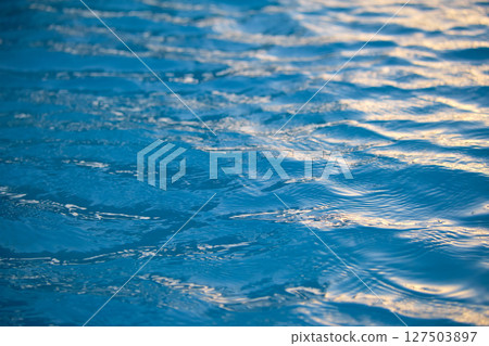 Closeup seascape surface of blue sea water with small ripple waves. 127503897