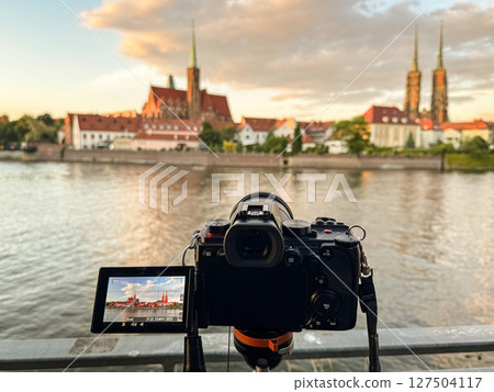 Camera Capturing Historic Cityscape During a Beautiful Golden Hour Scene Camera Capturing Historic Cityscape During a Beautiful Golden Hour Scene 127504117