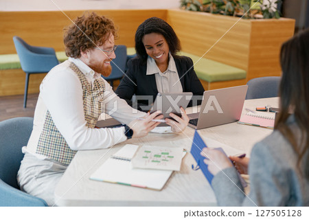 Engaging Collaborative Business Meeting Taking Place in a Modern Office Environment Setting Engaging Collaborative Business Meeting Taking Place in a Modern Office Environment Setting 127505128