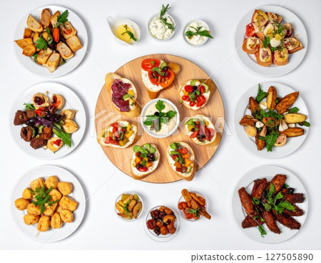 Assorted Appetizers on White Background 127505890
