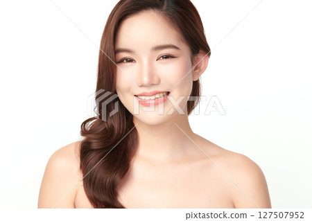 A beautiful young Asian woman with clean, fresh skin against a white background. Skincare, facial treatment, cosmetology, beauty, and spa. An elegant portrait of an Asian woman. A beautiful young Asian woman with clean, fresh skin against a white background. Skincare, facial treatment, cosmetology, beauty, and spa. An elegant portrait of an Asian woman. 127507952