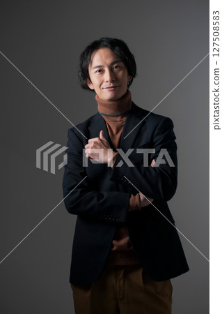 Businessman with arms folded Businessman with arms folded 127508583