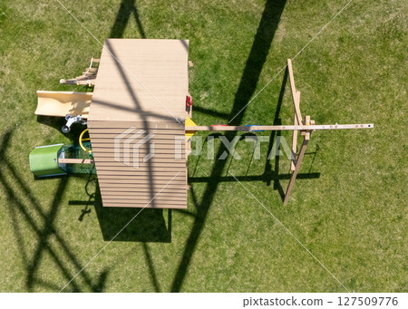 aerial view directly above a playground set in a backyard aerial view directly above a playground set in a backyard 127509776