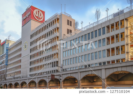 March 24 2025 Urban Street Scene Featuring Modern Building and Public Transportation 127510104