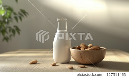 Almond bottle glass milk and almonds on plate in wooden table kitchen blurred background 127511463