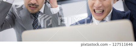 A boss is surprised at the computer along with his subordinates. Cyber DDoS attack? Banner without a face A boss is surprised at the computer along with his subordinates. Cyber DDoS attack? Banner without a face 127511646