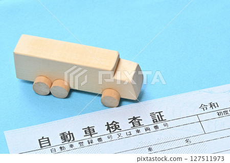 Image of electronic vehicle inspection certificate and large truck 127511973