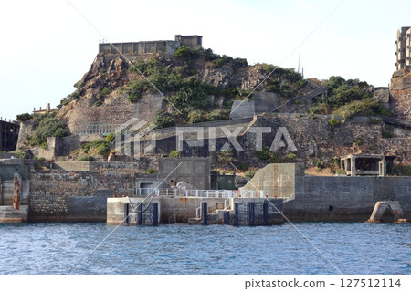 Gunkanjima (Hashima) The remains of the coal mining facility on the central hill and the Dolphin Pier Gunkanjima (Hashima) The remains of the coal mining facility on the central hill and the Dolphin Pier 127512114