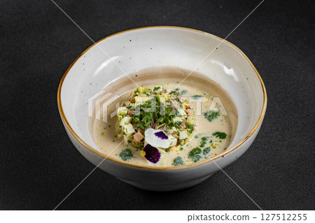 Cold summer soup okroshka. Light soup in a white bowl. Cold summer soup okroshka. Light soup in a white bowl. 127512255
