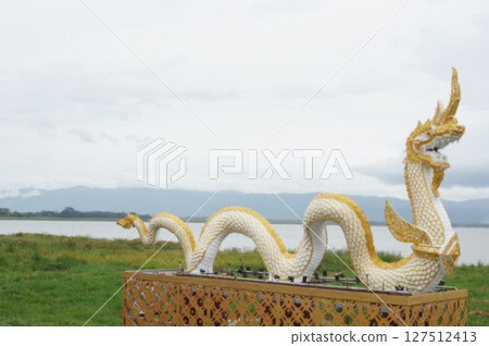 Naka giant snake sculpture beside of Kwan Phra Yao lake, North of Thailand Naka giant snake sculpture beside of Kwan Phra Yao lake, North of Thailand 127512413