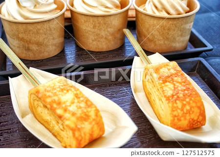 Delicious rolled omelet and cup ice cream 127512575