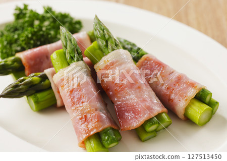 Bacon wrapped asparagus served on a plate Bacon wrapped asparagus served on a plate 127513450
