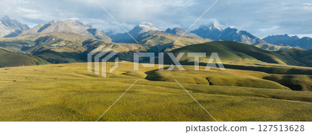 High altitude grassland and snow capped mountain in Sichuan, China High altitude grassland and snow capped mountain in Sichuan, China 127513628