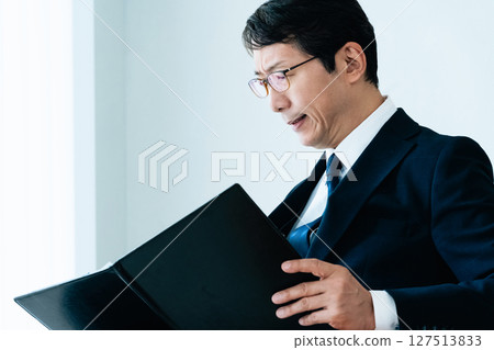 Businessmen checking materials 127513833