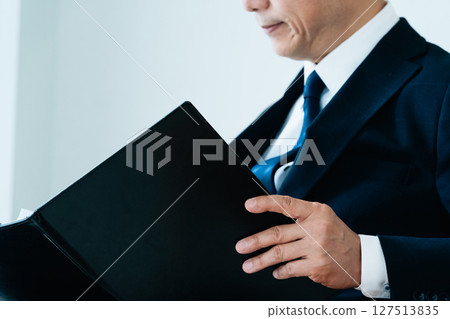 Businessmen checking materials 127513835