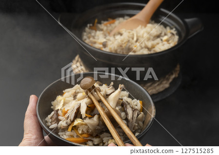 Mushroom rice cooked in a clay pot served in a rice bowl Mushroom rice cooked in a clay pot served in a rice bowl 127515285