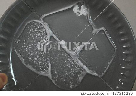 Dry ice on a plate 127515289