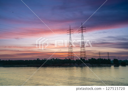 Power Lines Over Nile River at Sunset Near Esna Lock Egypt 127515720
