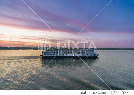 Nile River Cruise Passing Esna Lock Aswan Egypt at Sunset. Nile River Cruise Passing Esna Lock Aswan Egypt at Sunset. 127515724