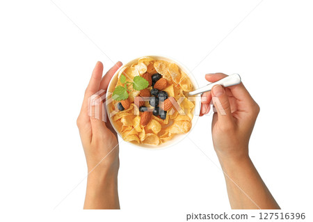 Hands holding a bowl of cereal with almonds, isolated on white 127516396