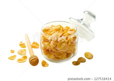 Jar of cornflakes with honey, isolated on white background 127516414