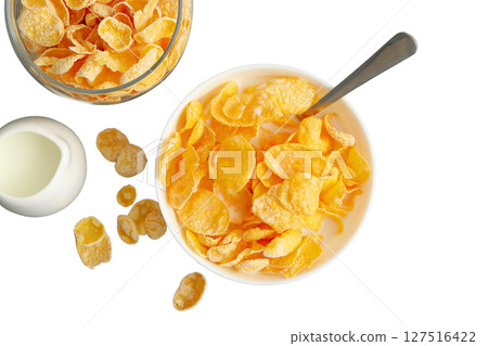 Bowl contains cornflakes with milk and spoon, isolated on white Bowl contains cornflakes with milk and spoon, isolated on white 127516422