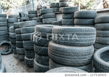 Used Worn Out Car Tires Piled Outdoors Used Worn Out Car Tires Piled Outdoors 127516435