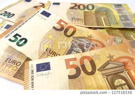 Euro banknotes in various denominations, close-up shot highlighting design and security details, finance concept Euro banknotes in various denominations, close-up shot highlighting design and security details, finance concept 127516539