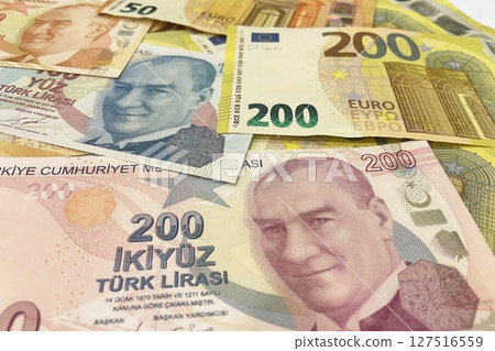 Turkish Lira and Euro banknotes side by side, representing currency exchange, finance, and global economy. 127516559