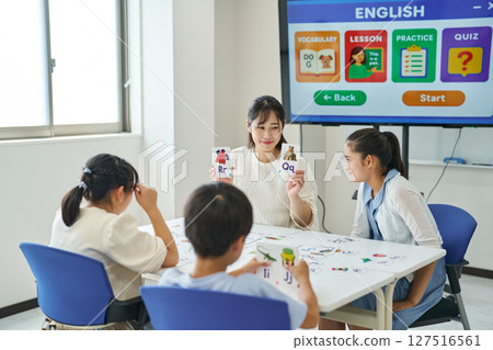 Kids learning with alphabet cards 127516561