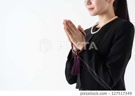 Young woman in mourning clothes, hands 127517349