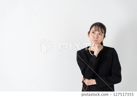 Woman in mourning worries Woman in mourning worries 127517355