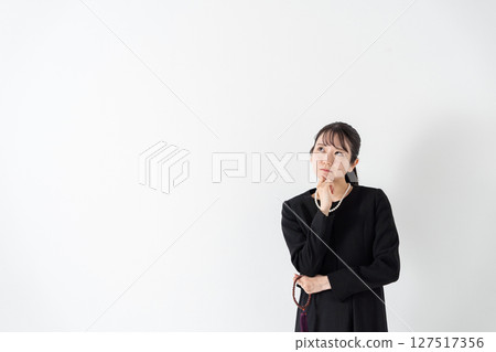 Woman in mourning worries 127517356