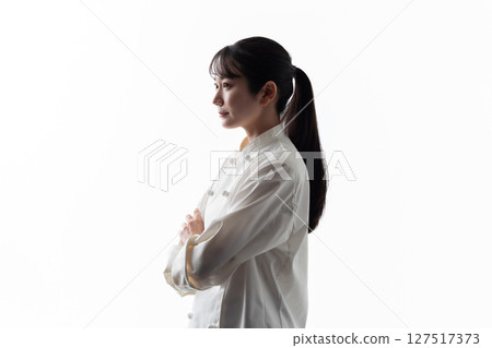 Woman in chef's coat silhouette thinking Woman in chef's coat silhouette thinking 127517373