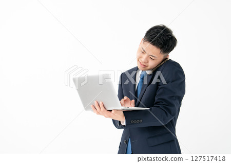 Young male business multitasking Young male business multitasking 127517418