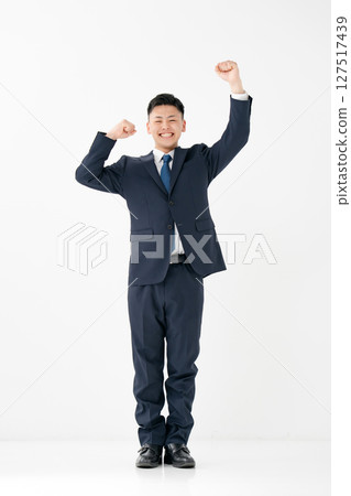 Young male business whole body fist pump 127517439