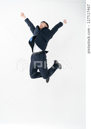 Young male business jump Young male business jump 127517467