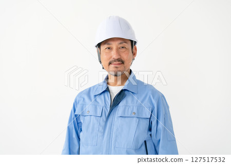 Man in work clothes Helmet 127517532