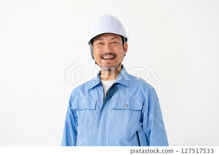 Man in work clothes Helmet 127517533