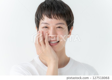 Man touching his cheek, beauty boy 127518068