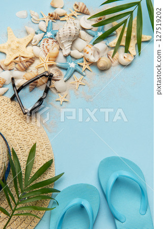 Beach accessories creating a summer holiday background with copy space 127519202
