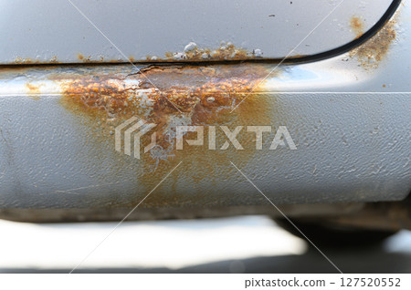 Close-up of rusty car sill with corrosion damage. 127520552