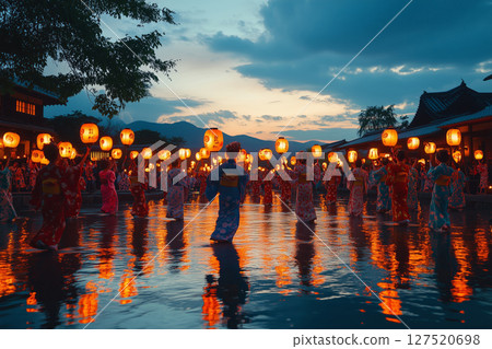 a traditional Obon dance performed at night, participants wearing yukatas dancing in a circle under glowing lanterns 127520698