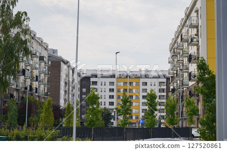 New modern block of flats in green area. residential apartment with flat buildings exterior. luxury house complex. Part of City Real estate property, condo architecture. apartment insurance concept. New modern block of flats in green area. residential apartment with flat buildings exterior. luxury house complex. Part of City Real estate property, condo architecture. apartment insurance concept. 127520861