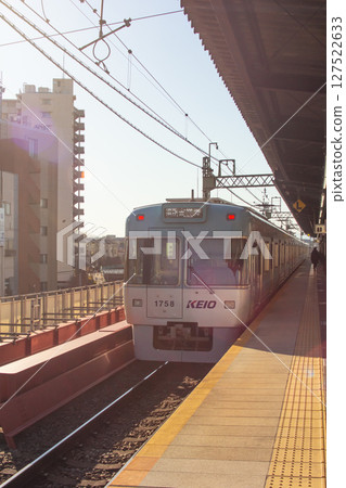 Keio Line train running at Takaido Station 127522633