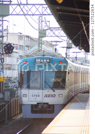 Keio Line train running at Takaido Station 127522634