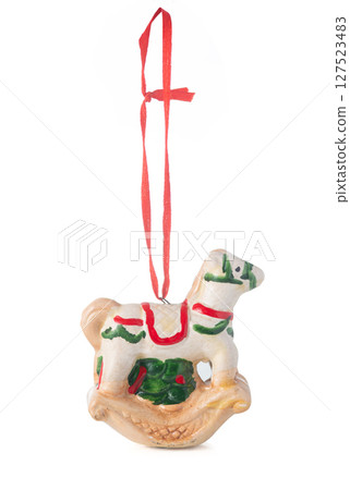 Handmade ceramic Christmas ornament of a rocking horse with red ribbon, isolated on a white background,  Handmade ceramic Christmas ornament of a rocking horse with red ribbon, isolated on a white background,  127523483