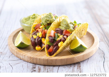 Vegan mexican Taco with beans and guacamole Vegan mexican Taco with beans and guacamole 127523772