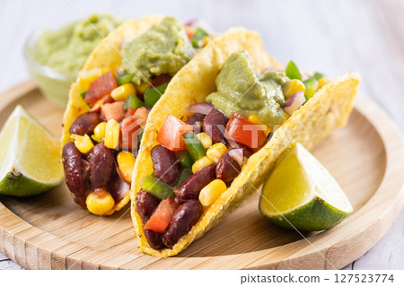 Vegan mexican Taco with beans and guacamole Vegan mexican Taco with beans and guacamole 127523774
