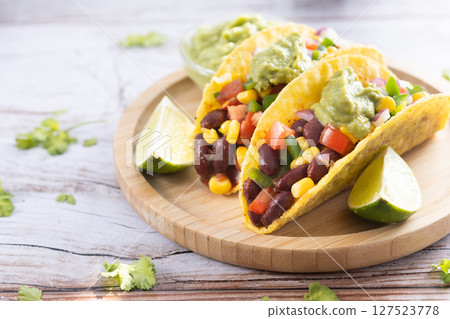 Vegan mexican Taco with beans and guacamole 127523778
